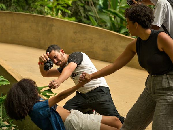 Diverse group of people smiling during a light yoga session.